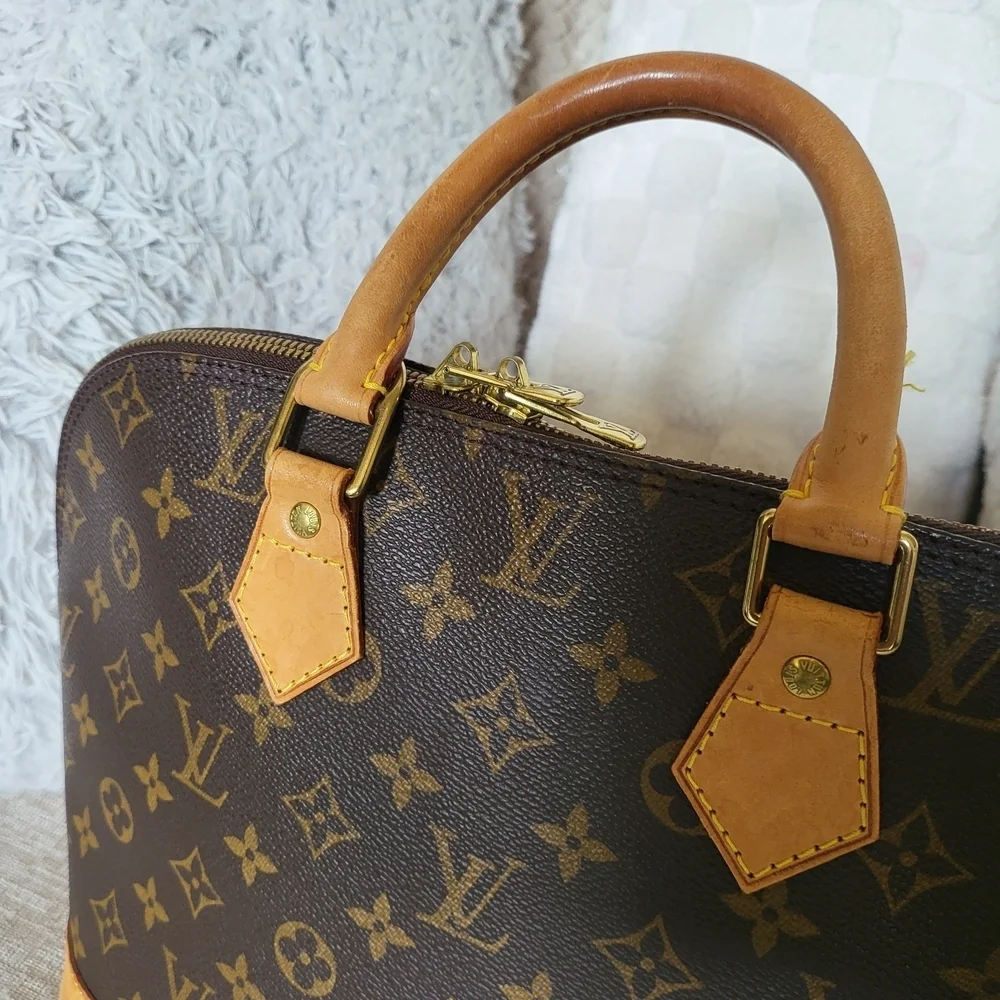 Authentic Louis Vuitton Monogram Alma PM Hand Bag..